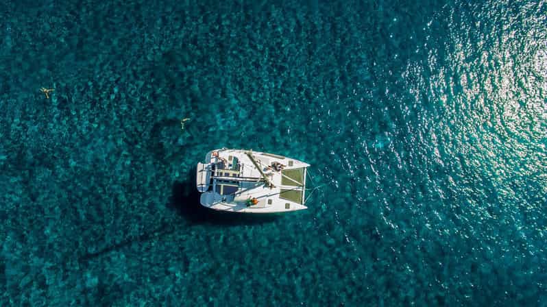 Santorini: Private Catamaran Cruise with Food & Drinks - Red Beach, White Beach, and the southern coast