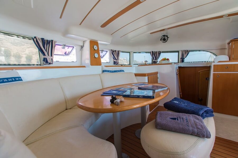 Santorini: Private Catamaran Cruise with Food & Drinks - Swimming and snorkeling in the Aegean