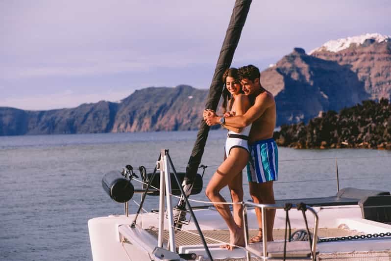 Santorini: Private Catamaran Tour with BBQ Meal and Drinks - Indian Rocks, the lighthouse, and the caldera