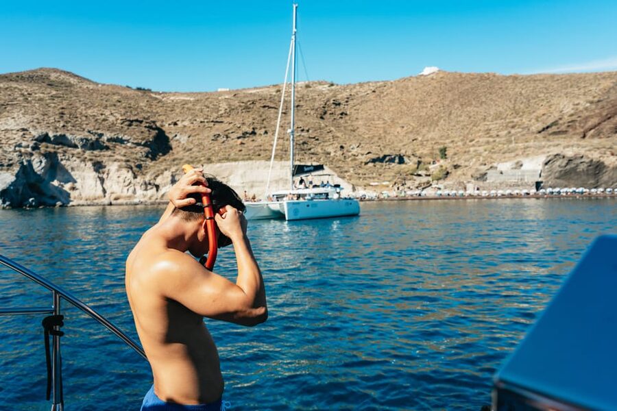 Santorini: Sailing Catamaran Cruise with BBQ and Drinks - Getting close to the volcano
