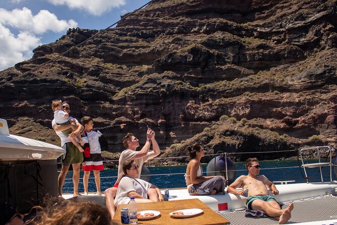 Santorini Sailing Catamaran Daily Cruises w/ Greek BBQ @Thirasia - Leaving Vlychada and meeting Santorini from the sea