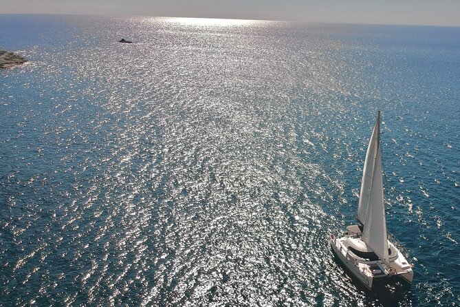 Santorini: Special Occasions Catamaran Cruise, All Inclusive - Red Beach gives the cruise its first dramatic stop