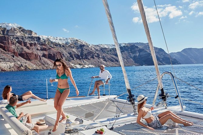 Santorini Sunset Luxury Sailing Catamaran Cruise with BBQ, drinks, transfer - Red Beach starts the swimming day