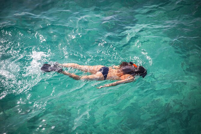Small-Group Cruising and Snorkeling Catamaran Tour - Music, crew style, and the overall mood