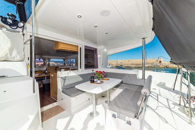Small Group Santorini Catamaran Cruise with BBQ - Mesa Pigadia combines a swim with the BBQ