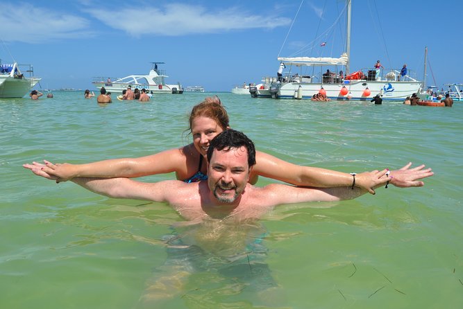 Snorkeling Catamaran Tour & Parasailing - Drinks, fresh fruit, and the onboard mood