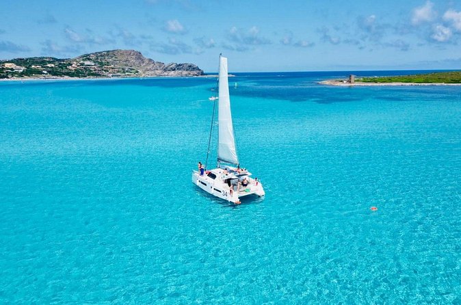 Stintino Half Day Catamaran Tour to La Pelosa with Aperitif - Skipper, crew, and the small-catamaran setup
