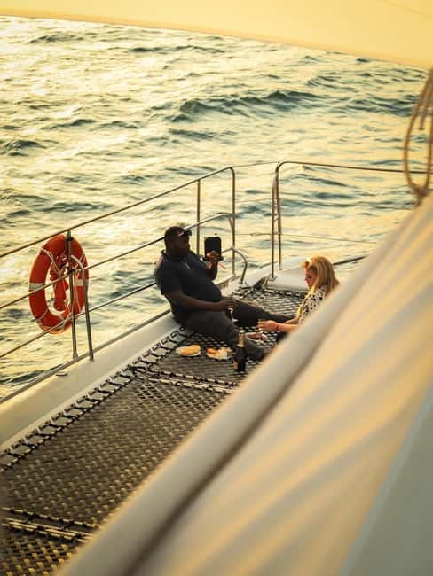 Sunny Beach: Sunset Catamaran Cruise with Dinner & Prosecco - Boarding the catamaran and losing your shoes