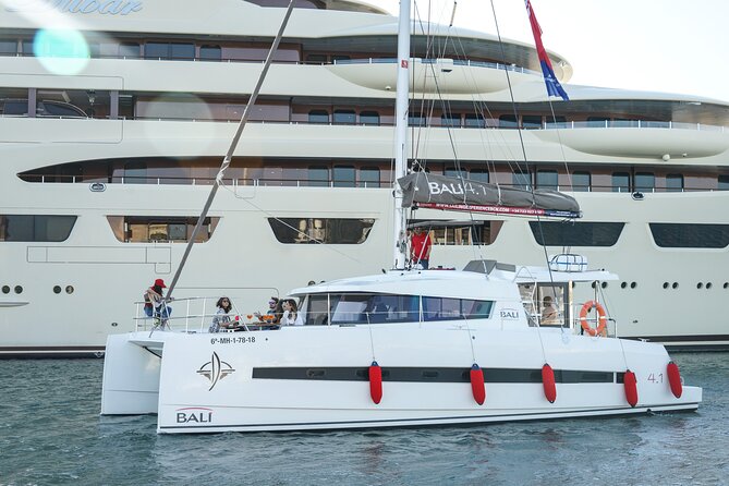 Sunset Catamaran: Small Group, Drinks, Snacks & Dinner Upgrade - The Sunset and Barcelona from Offshore