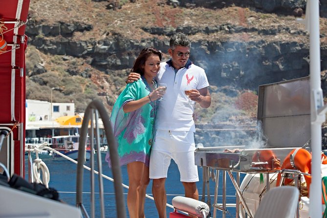 Sunset Sailing Catamaran Cruise in Santorini with BBQ and Drinks - Sailing past the volcano and Palea Kameni