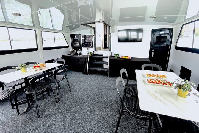 Vivid 90-Minute Sydney Harbour Intimate Catamaran Cruise with Canapes - Weather, clothing, and practical comfort