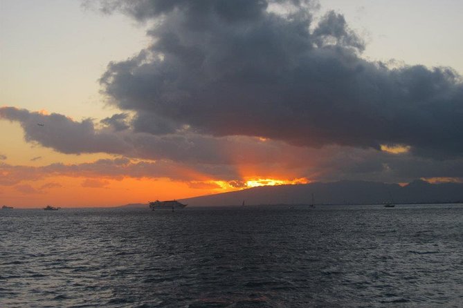 Waikoloa Signature Catamaran Sunset Sail - Black lava, blue water, and possible wildlife